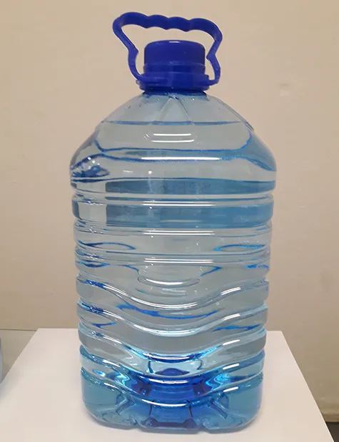 Empty 5 litre PET bottle with a blue carry handle