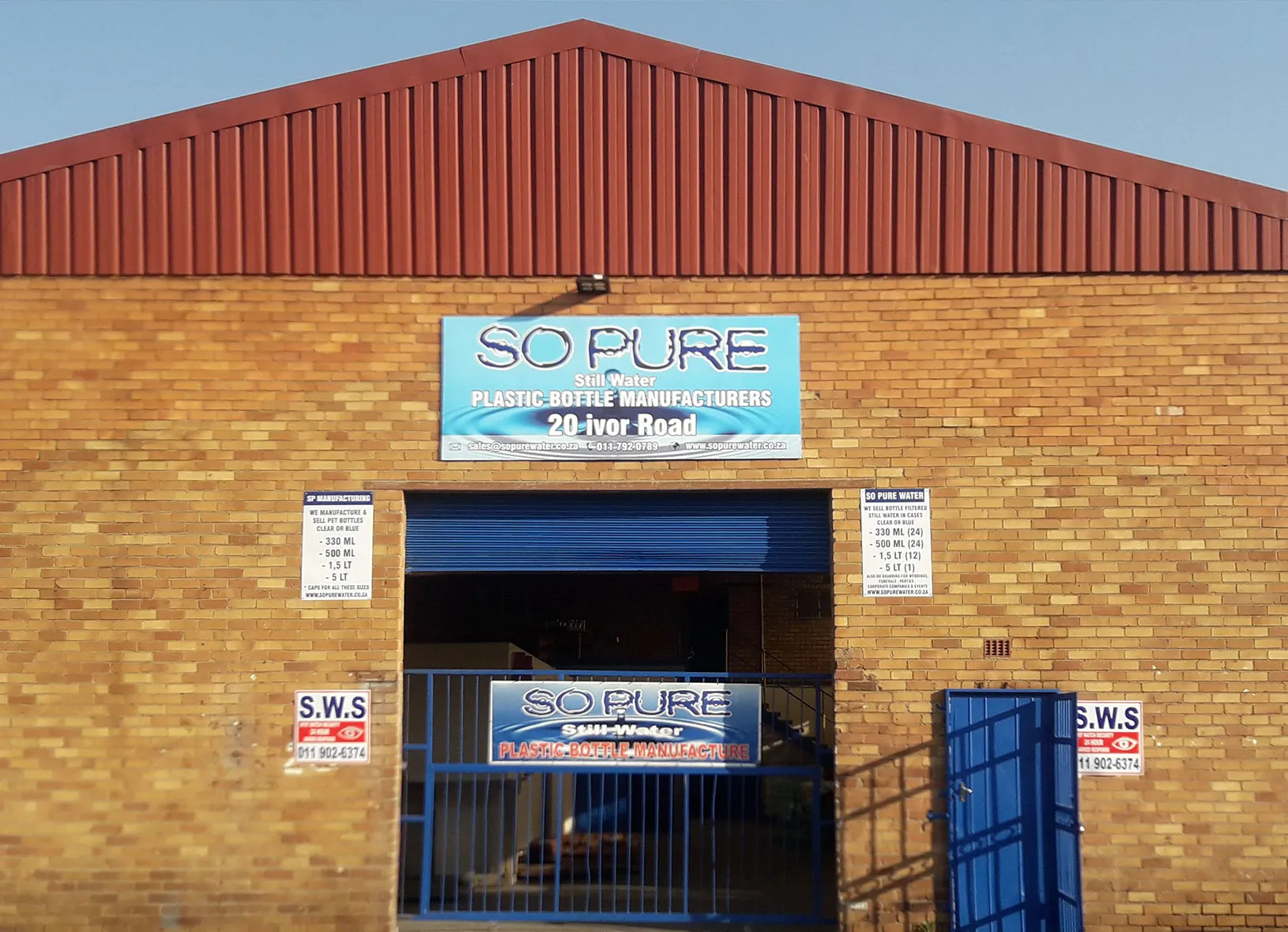 The So Pure Water factory at 20 Ivor Road: a face-brick building with a red roof and blue So Pure signs over the roller door