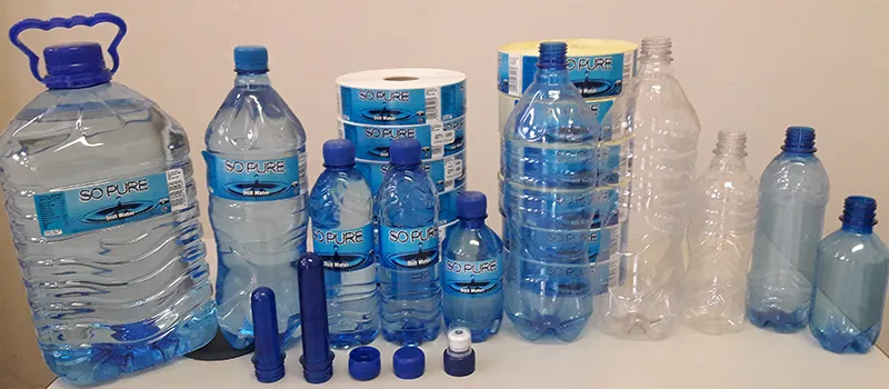 So Pure bottled water in 330ml, 500ml, 1.5 litre and 5 litre sizes next to preforms, caps and label rolls